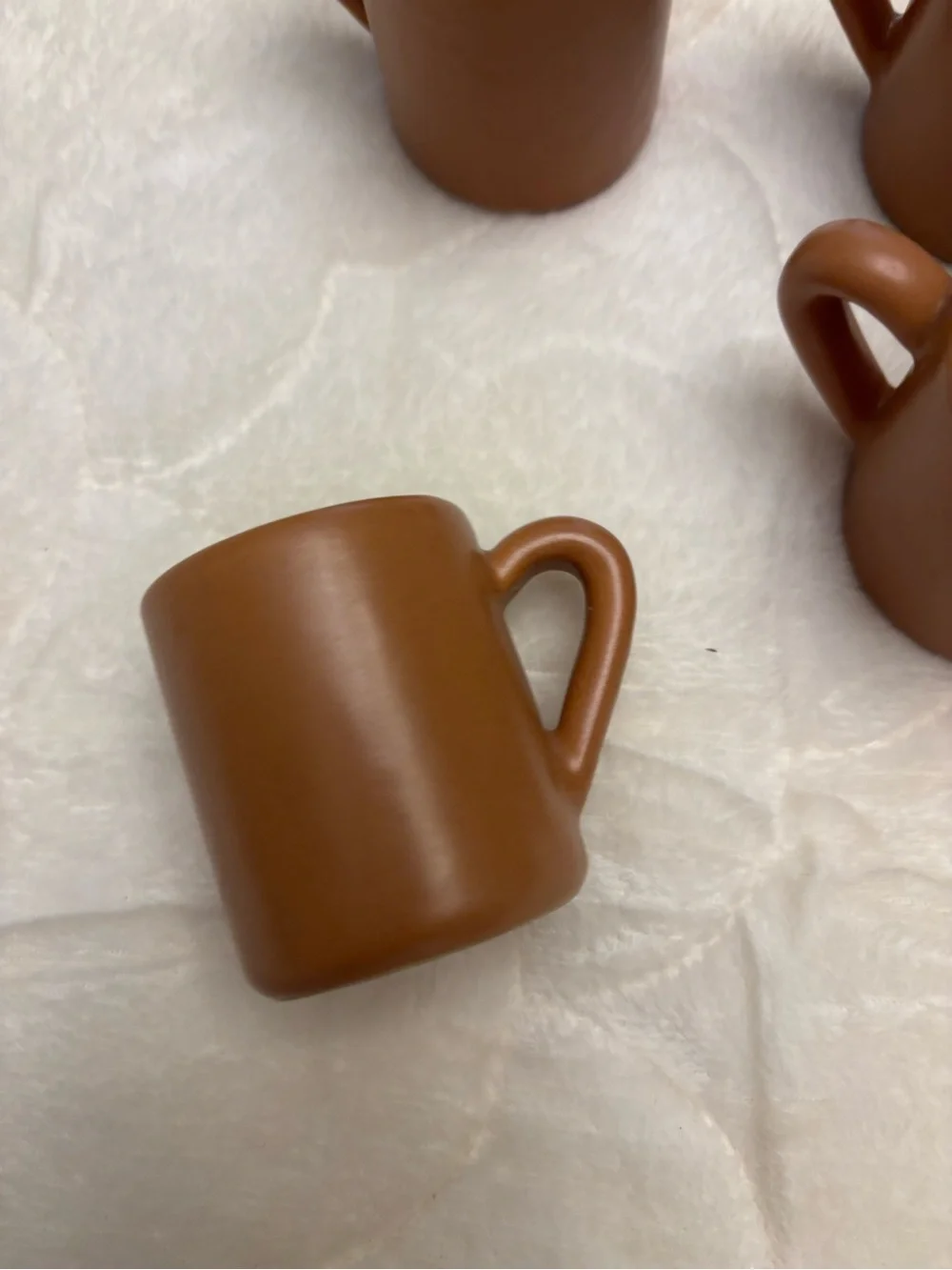 Four brown stoneware pottery expresso shot coffee mugs